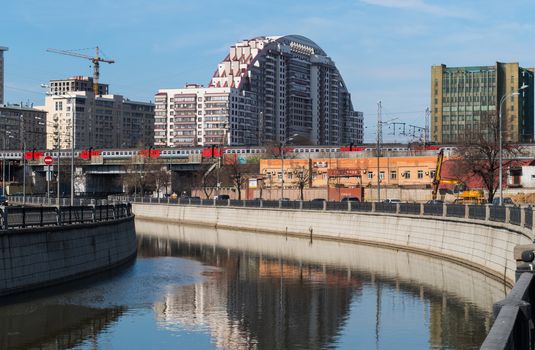 Moscow - River Yauza passing train and new architecture 28/3/16