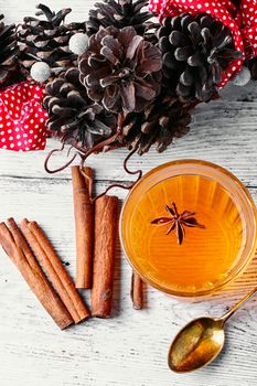 pumpkin jelly drink with anise in the background with wreath of fir cones in autumn