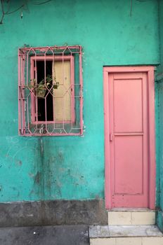 Colorful Indian house. Bright green building in Kolkata, West Bengal, India