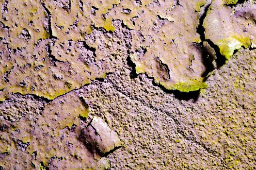 Texture of old broken wall with cracked paint surface.