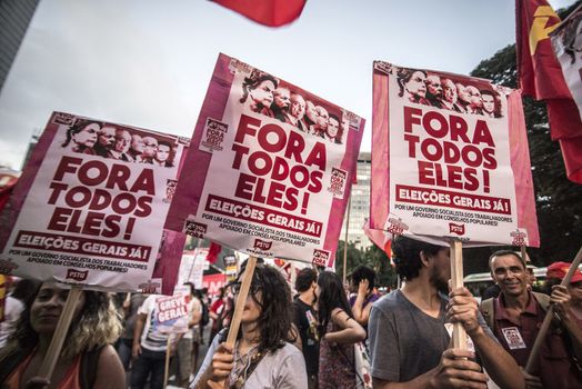 BRAZIL, Sao Paulo: Protesters hold signs reading All of them out! as hundreds of people demonstrate for the impeachment of President Dilma Rousseff and early elections at Avenida Paulista in Sao Paulo, southern Brazil, on April 1, 2016. Brazilian President Dilma Rousseff is facing possible impeachment by Congress. The effort comes amid an angry public mood over the South American nation's worst recession in decades and a big bribery scandal at the state oil company Petrobras. 