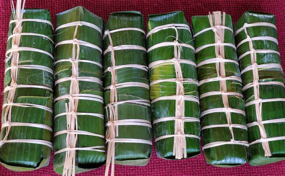 Vietnamese food, traditional food on tet holiday in spring, banh tet also name Cylindric glutinous rice cake, make from sticky rice, mung been, cover by banana leaf, tradition eating on lunar new year