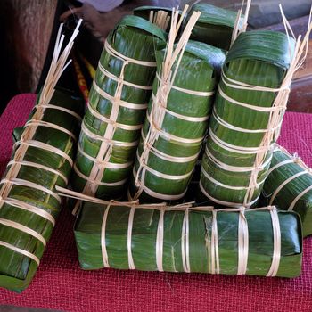 Vietnamese food, traditional food on tet holiday in spring, banh tet also name Cylindric glutinous rice cake, make from sticky rice, mung been, cover by banana leaf, tradition eating on lunar new year