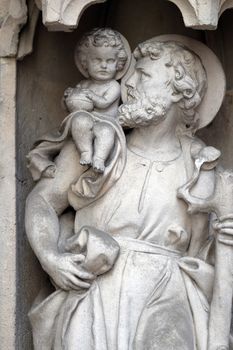 Saint Christopher on the portal of Parish Church of the Holy Blood in Graz, Styria, Austria