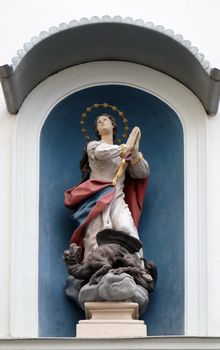 Virgin Mary, statue on the house facade in Graz, Styria, Austria