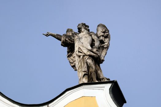 Angel on facade of Barmherzigenkirche church in Graz, Styria, Austria