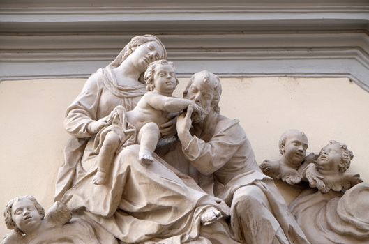 Holy Family, statue on the house facade in Graz, Styria, Austria