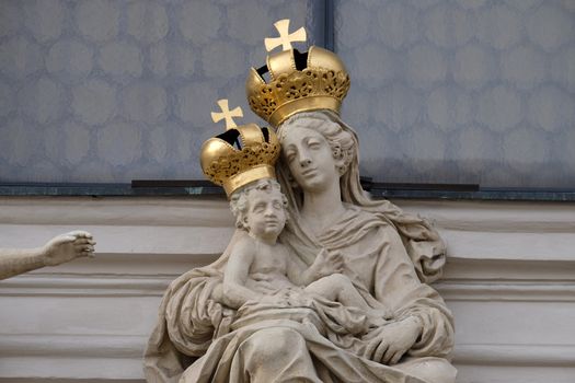 Virgin Mary with baby Jesus on the portal of Mariahilf church in Graz, Styria, Austria