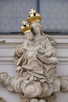 Virgin Mary with baby Jesus on the portal of Mariahilf church in Graz, Styria, Austria