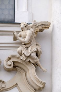 Angel on the portal of Mariahilf church in Graz, Styria, Austria