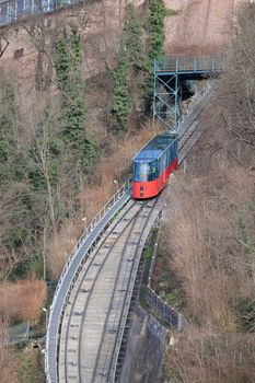 Modern funicular climbing to Schlossberg in Graz, Austria