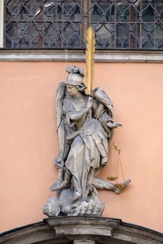 Archangel Michael on the portal of Dreifaltigkeitskirche ( Holy Trinity ) church in Graz, Styria, Austria