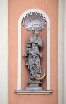 Virgin Mary on the portal of Dreifaltigkeitskirche ( Holy Trinity ) church in Graz, Styria, Austria