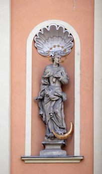 Virgin Mary on the portal of Dreifaltigkeitskirche ( Holy Trinity ) church in Graz, Styria, Austria