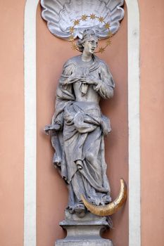 Virgin Mary on the portal of Dreifaltigkeitskirche ( Holy Trinity ) church in Graz, Styria, Austria