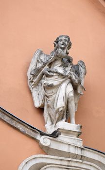 Angel on the portal of Dreifaltigkeitskirche ( Holy Trinity ) church in Graz, Styria, Austria