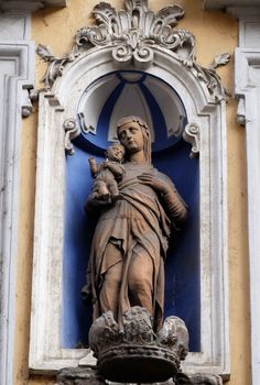 Virgin Mary with baby Jesus, statue on the house facade in Graz, Styria, Austria