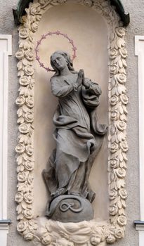Virgin Mary, statue on the house facade in Graz, Styria, Austria