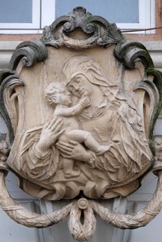 Virgin Mary with baby Jesus, statue on the house facade in Graz, Styria, Austria on January 10, 2015.