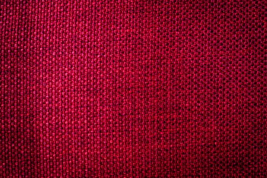 Rustic canvas fabric texture in red color.