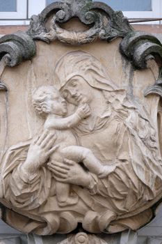 Virgin Mary with baby Jesus, statue on the house facade in Graz, Styria, Austria