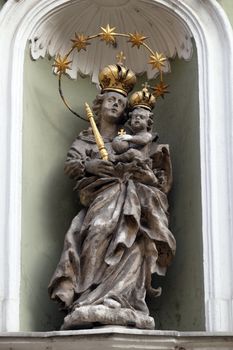 Virgin Mary with baby Jesus, statue on the house facade in Graz, Styria, Austria