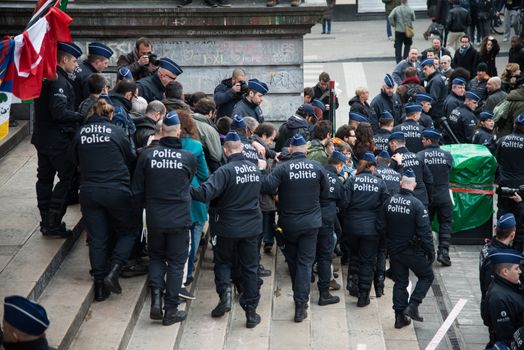 BELGIUM, Brussels: Police officers intervene at the Beurs-La Bourse square, in Bruxelles, in order to arrest antiracist activists who have tried to demonstrate even though any demonstration has been banned by Belgian authorities, on April 2, 2016.