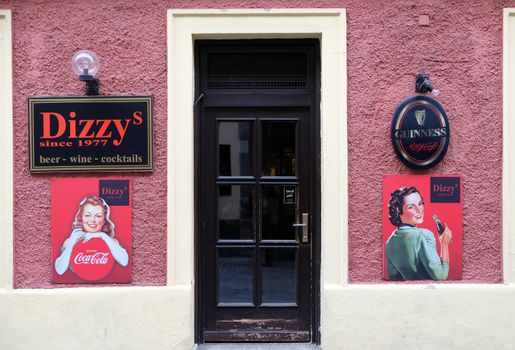 Dizzy bar and advertisement for Coca Cola in Graz, Styria, Austria