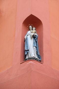 Virgin Mary with baby Jesus, statue on the house facade in Graz, Styria, Austria