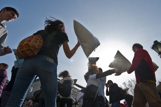 SLOVAKIA, Bratislava: Feathers fall on participants of a public pillow fight in Hviezdoslavovo námestie square, central Bratislava, on April 2, 2016.