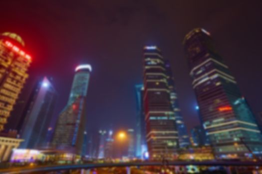 Shanghai skyline at night out of focus. The blur background