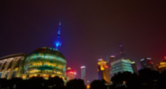 Shanghai skyline at night out of focus. The blur background