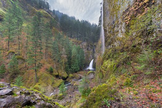 Wahclella Falls in Columbia River Gorge Oregon with seasonal waterfall on wall of cliff