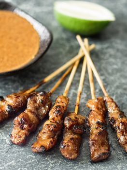 close up of rustic indonesian satay meat skewer