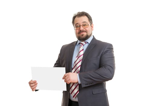 the adult man holds a sheet of paper in hand