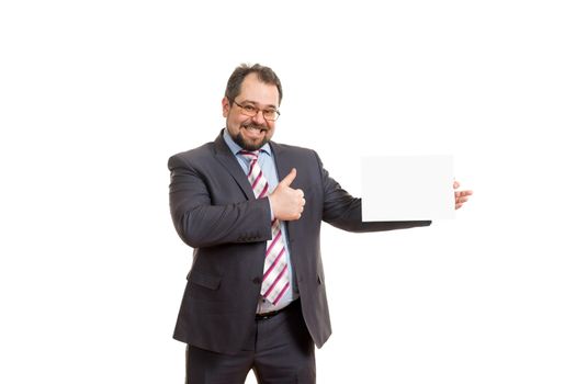 the adult man holds a sheet of paper in hand