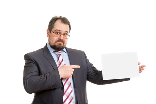 the adult man holds a sheet of paper in hand