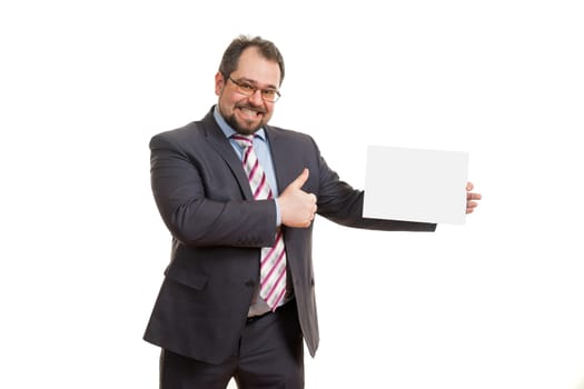 the adult man holds a sheet of paper in hand