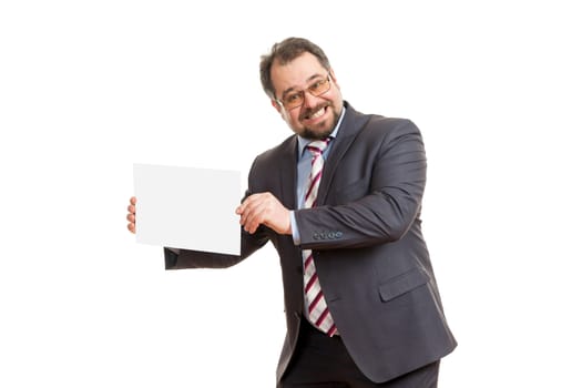 the adult man holds a sheet of paper in hand