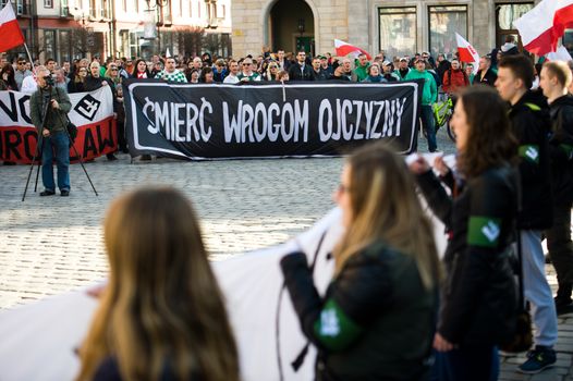 POLAND, Wroclaw: Demonstrators hold a banner which reads Death to Homeland Enemies during in an anti-immigrant and anti-Muslim protest organized by Oboz Narodowo-Radykalny (National Radical Camp) in Wroclaw, western Poland, on April 2, 2016.