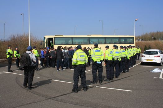 UNITED KINGDOM, Dover: Police officers stand in a line as anti-racism demonstrators block the route of a planned far right march in Dover, southern England, on April 2, 2016.The march, which began shortly after 1pm, was disrupted as anti-fascist protesters refused to assemble in a designated area near Marine Parade, leading to eight arrests. Police arrested 13 people in total in Dover the same day as far-right and anti-fascist groups both held protests.