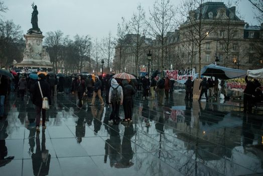 FRANCE, Paris : People join the Nuit Debout or Standing night movement at the Place de la Republique in Paris on April 2, 2016. A few hundred people rallied to demand the halt of home evictions which can begin the day after the end of the French winter break, after which tenants can be evicted from their homes. They also gathered to show their opposition to the labor reform law in the wake of the nationwide demonstration which took place on March 31, 2016.
