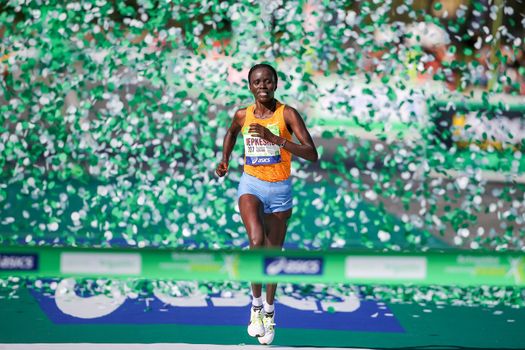 FRANCE, Paris: Kenyan Visiline Jepkesho passes the finish line during the 40th Paris Marathon, on April 3, 2016 in Paris. Kenya's Visiline Jepkesho won women race of 40th edition of the Paris marathon. Some 57,000 participants from 160 countries have registered with the race covering 42,195km starting on the Champs Elysees and crossing the French capital to the Bois de Vincennes on the east.