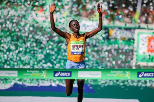 FRANCE, Paris: Kenyan Visiline Jepkesho passes the finish line during the 40th Paris Marathon, on April 3, 2016 in Paris. Kenya's Visiline Jepkesho won women race of 40th edition of the Paris marathon. Some 57,000 participants from 160 countries have registered with the race covering 42,195km starting on the Champs Elysees and crossing the French capital to the Bois de Vincennes on the east.