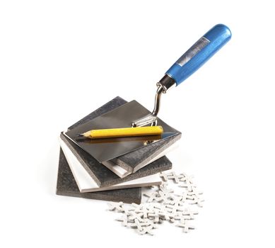 ceramic tiles and tools closeup on white background