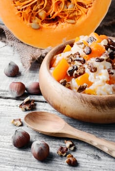 Porridge made with fresh pumpkin with the addition of nuts and hazelnuts