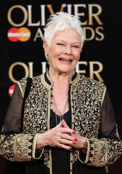 UK, London: Judi Dench and Anita Dobson hits the red carpet for the Olivier Awards at the Royal Opera House in London on April 3, 2016.