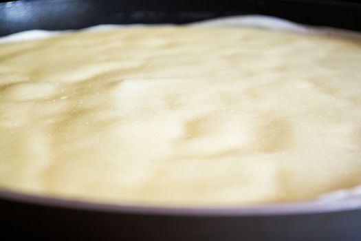 Frying pan with pancake baking on it