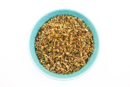 Tea herb in bowl on white background