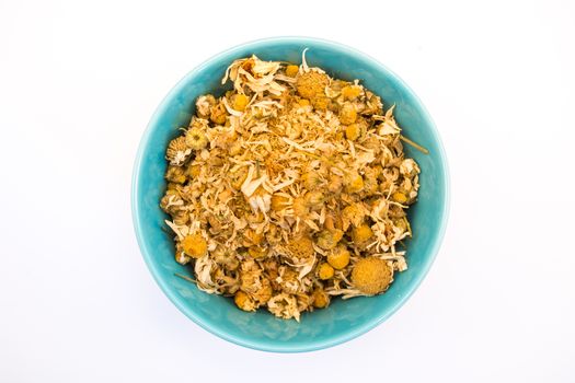 Tea herb in bowl on white background